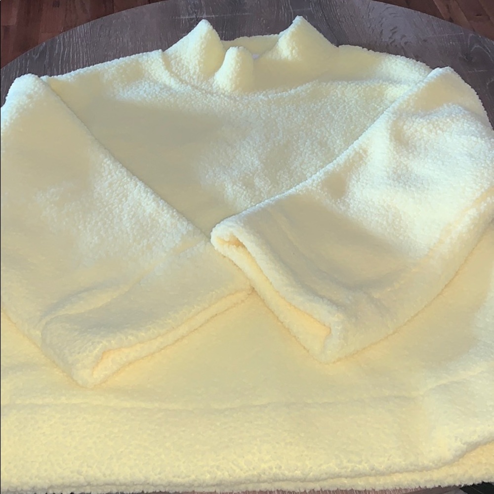 Yellow turtleneck sweater